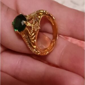 Gold ring with a dark green brilliant step cut stone, size 10